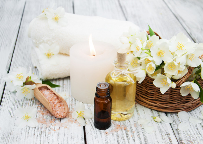 Spa concept with jasmine flowers on a old wooden background